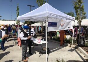 White canopy tent at outdoor community event